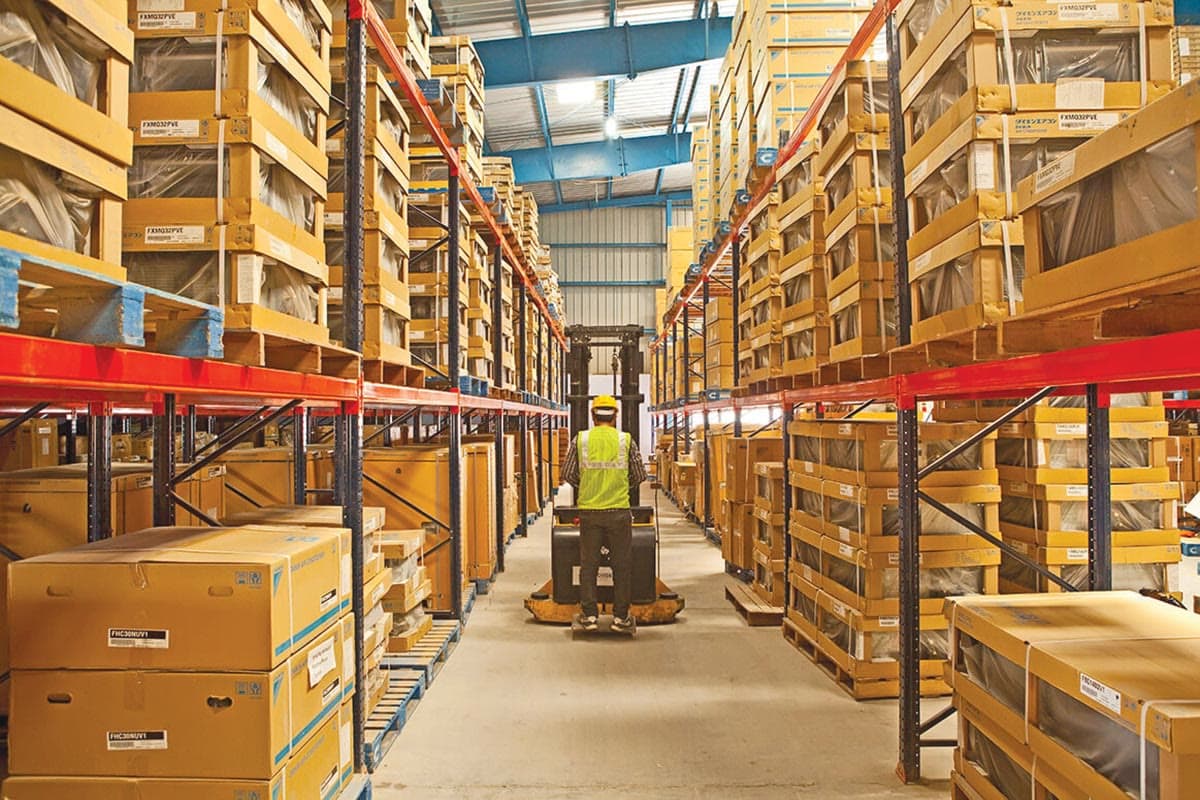 A warehouse aisle stacked with boxed goods