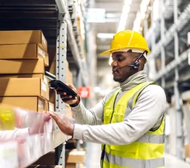 portrait-smiling-african-american-engineer-man-order-details-tablet-checking-goods-supplies-shelves-with-goods-background-warehouse-logistic-business-export_38019-2062